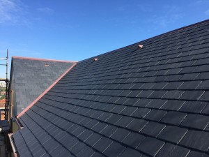Slate roof, copper roll top and vents