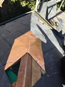 Copper fish tail, mitred slate roof hip Sydney