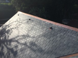 Copper roll top and vent, slate roof